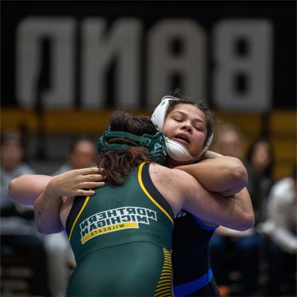 Sabrina Nauss grapples with an opponent from Northern Michigan